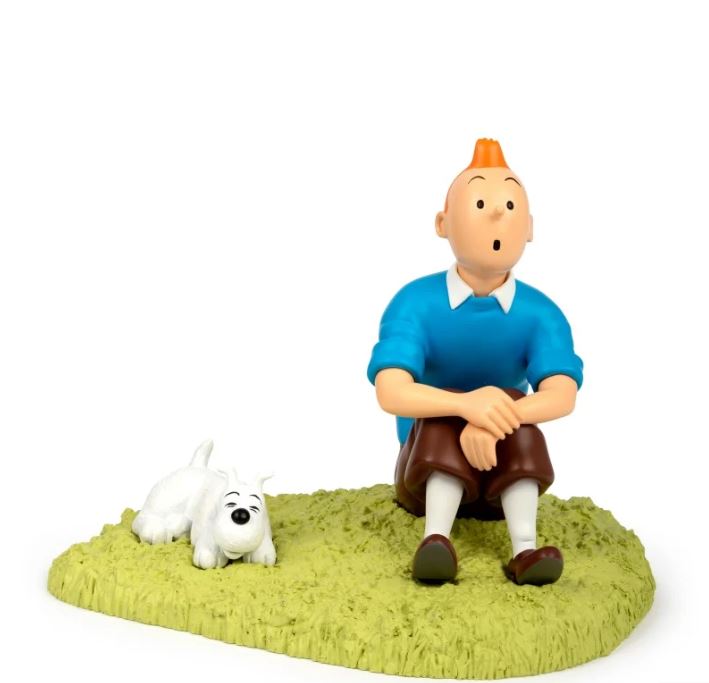 Tintin sitting in the grass statue