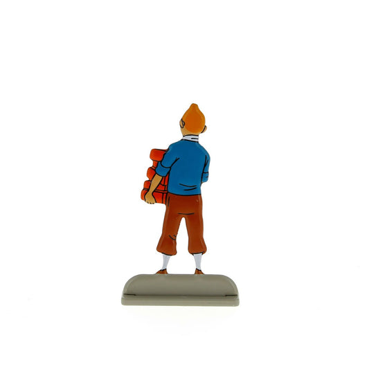 Tintin carrying bricks