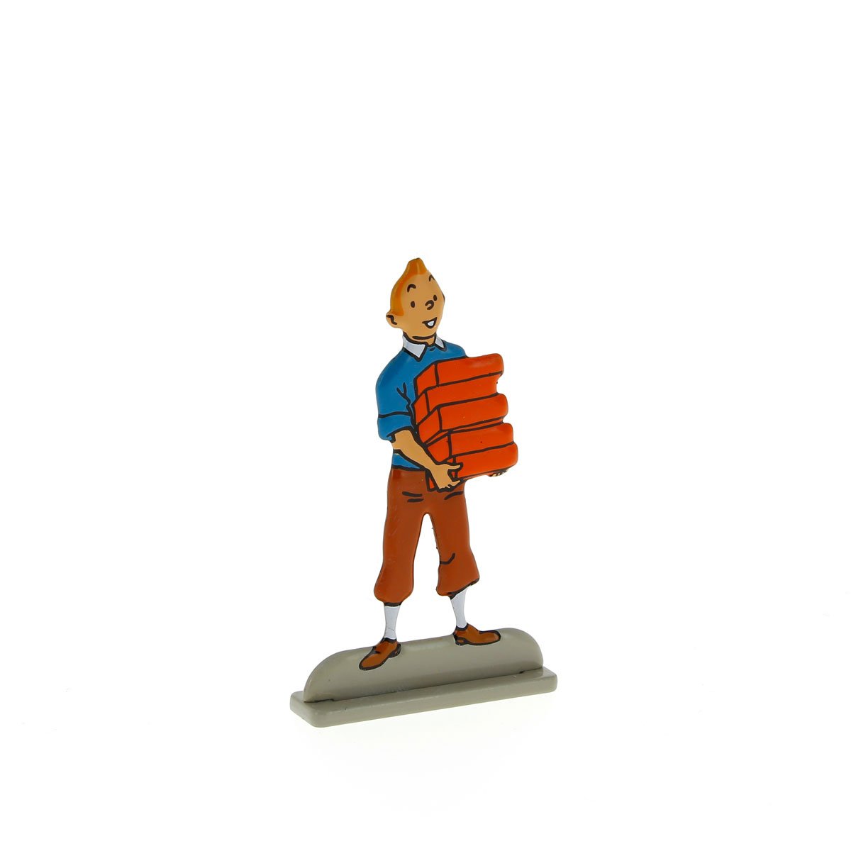 Tintin carrying bricks