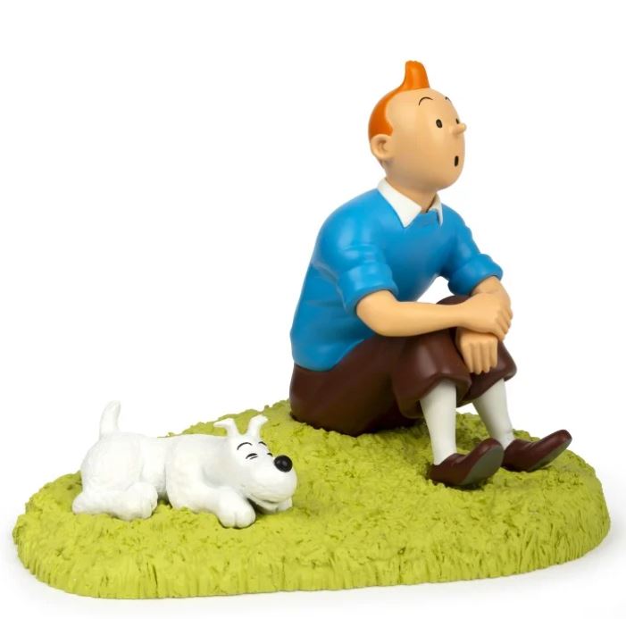 Tintin sitting in the grass statue